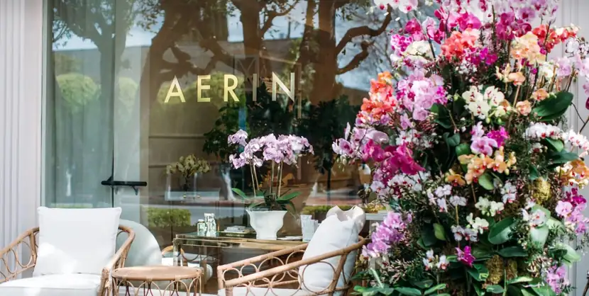 Shop window banked with bright spring flowers