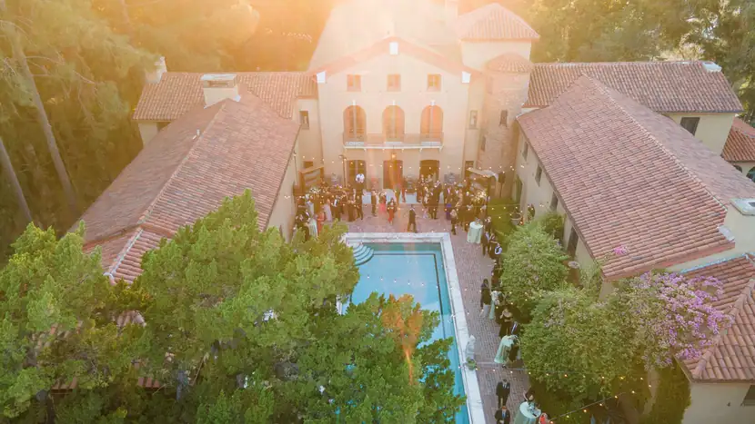 Aerial view of the estate and pool courtyard at golden hour